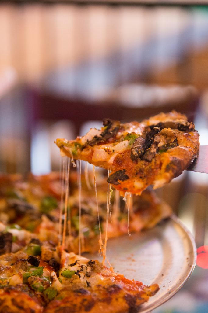 Sam & Greg's Pizzeria pizza with Mozzarella, pepperoni, Italian sausage, green pepper, black olives, mushrooms, onions