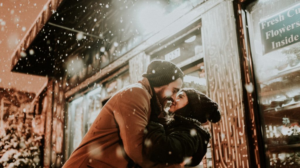 couple on a date outside in the snow